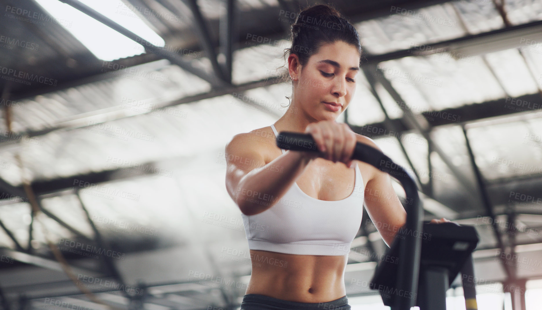 Buy stock photo Cycling, woman and gym with stationary bike, cardio workout and burning calories for wellness. Fitness, athlete and training challenge on exercise bicycle for physical activity, stamina and endurance