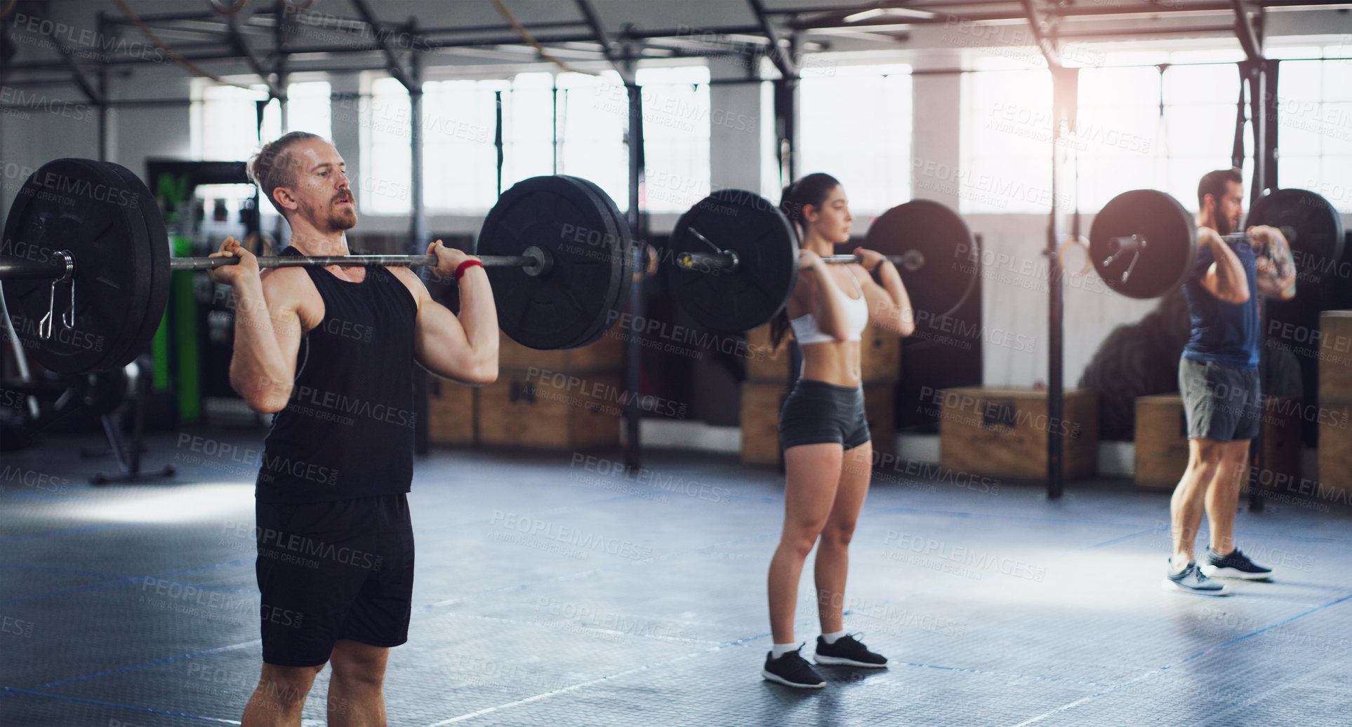 Buy stock photo Barbell, fitness and class with people in gym for bodybuilder, strength challenge and weightlifting. Training, exercise and wellness with friends in sports club for muscle growth and learning form 