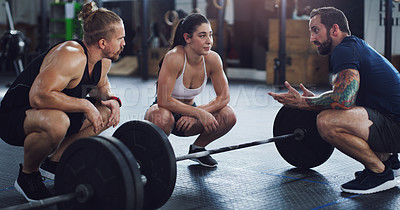Buy stock photo Shot of a group of people taking a break while exercising in a gym