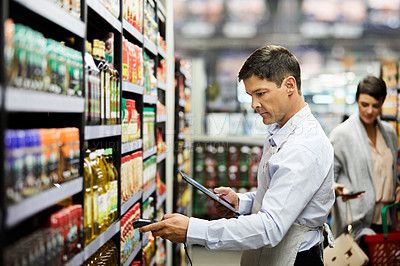 Buy stock photo 4k video footage of a store worker scanning products in a supermarket