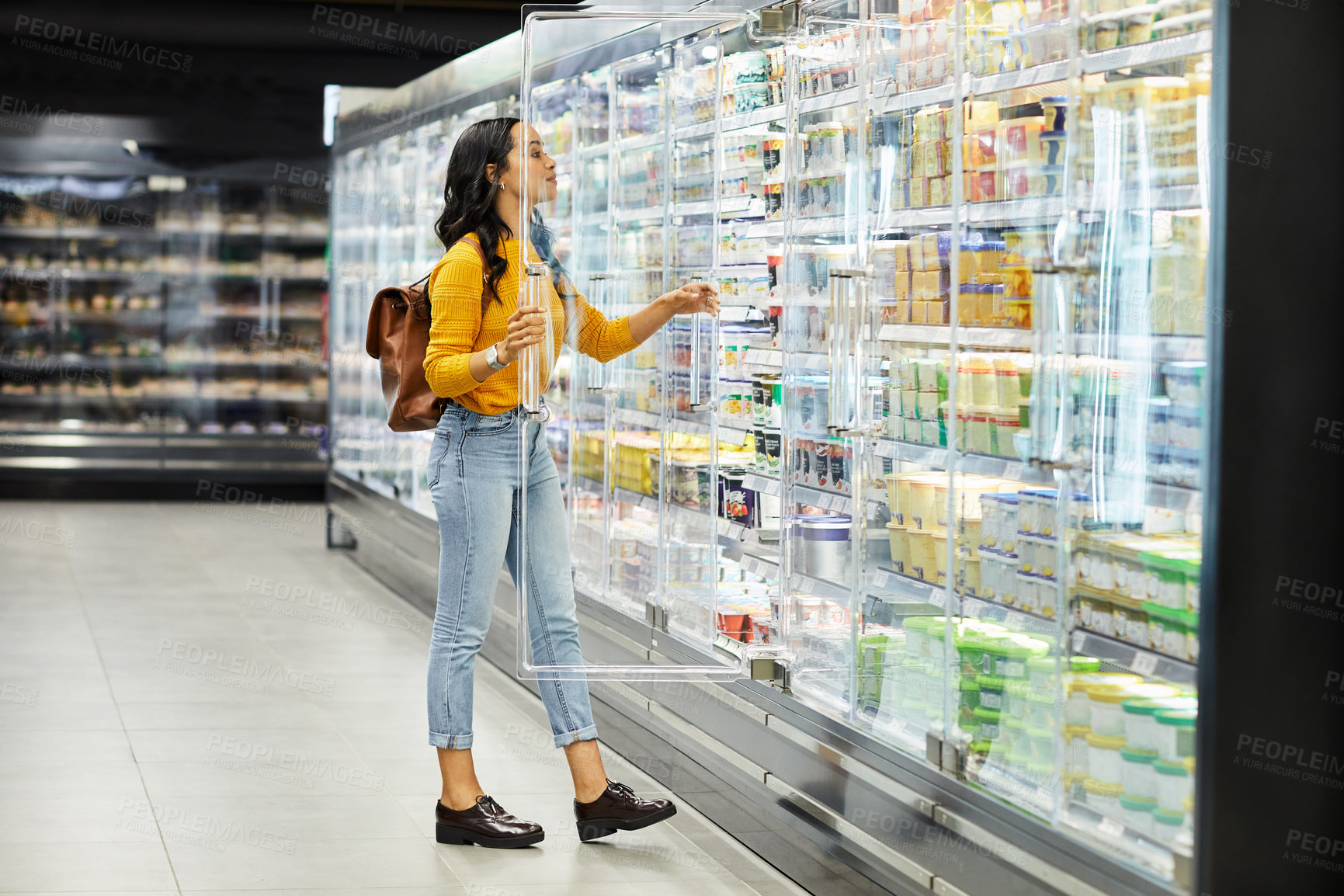Buy stock photo Fridge, shopping and search with woman in supermarket, food option, grocery and price discount. Customer purchase, inflation and store promotion with person in mall for retail, stock and check