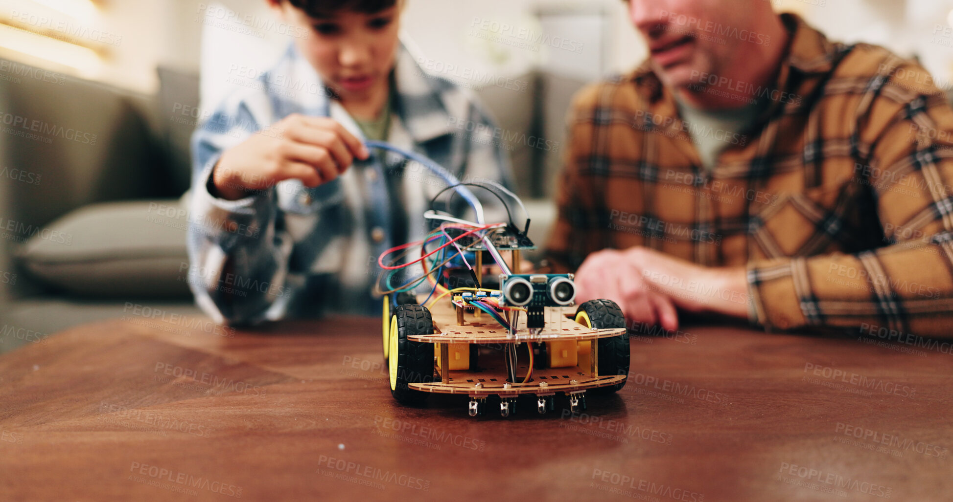 Buy stock photo Building, father or son in house with toy car, craft play or parent help in robotics activity. Connection, dad or boy in home with prototype, family support or bonding together in mechanic hobby.