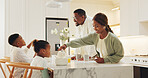 Happy, parents and children in kitchen for breakfast, meal and start day together in morning. Family, home and African mom, dad and kids with food for health, wellness and nutrition for growth