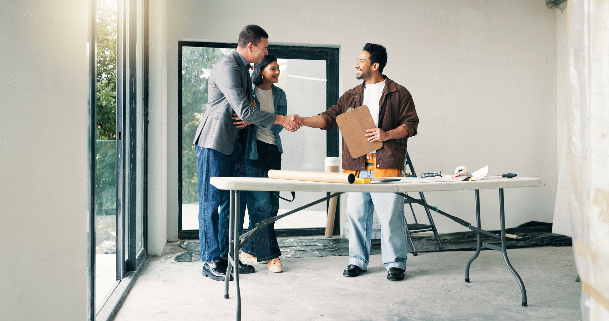 Buy stock photo Couple, architect and handshake with homeowner in agreement, deal and planning at construction site. Happy people, realtor welcome and shaking hands for remodeling, expansion or building dream home