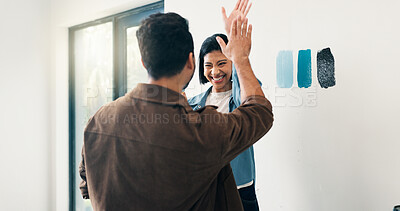 Buy stock photo High five, paint and choice with couple in home for diy project, remodeling or renovation success. Color palette, compare or decision with excited people for apartment makeover, motivation or support