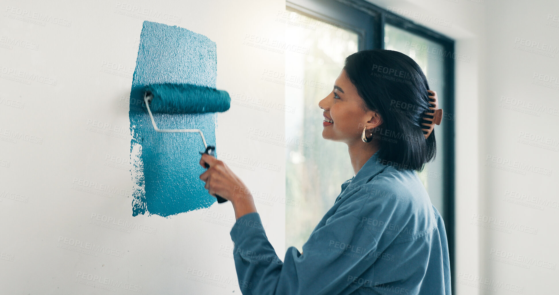Buy stock photo Painting, woman and happy with wall renovation for living room makeover, home upgrade or maintenance. Interior design, homeowner and smile with paintbrush for house improvement, change and diy decor