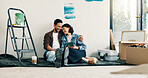 Home improvement, hug and tablet with couple on floor for discussion or project planning. Conversation, investment and real estate app with people in new house for construction or interior design