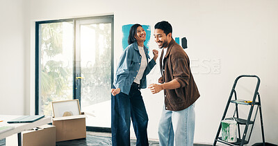 Buy stock photo Remodeling, fun or couple in home with dance, fresh start or happy moment in dream house. Property, renovation or people with playful groove, housing success or new homeowners in moving achievement.