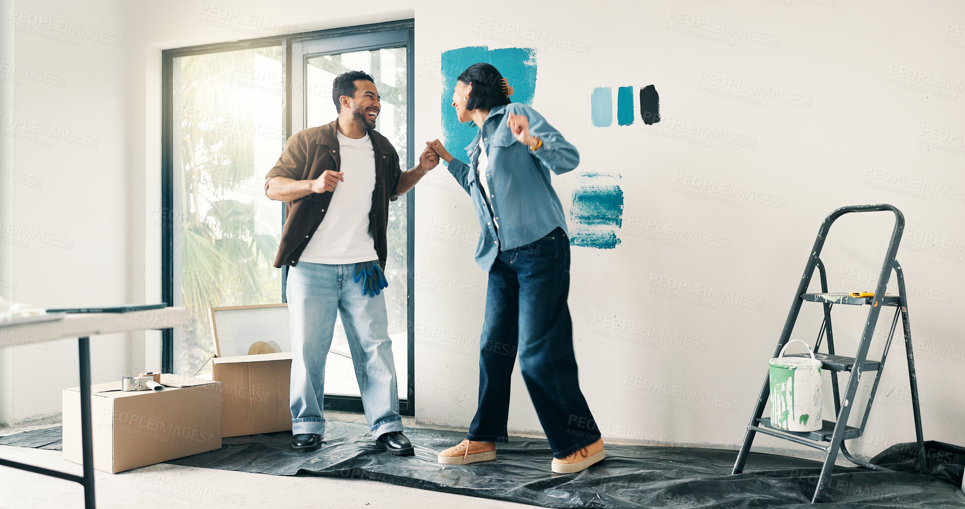 Buy stock photo Remodeling, fun or couple in living room with dance, fresh start or happy moment in dream house. Property, renovation or people with groove, housing success or new homeowners in moving achievement.