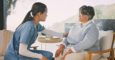 Buy stock photo Senior, woman or discussion with nurse for assisted living, healthcare or help in retirement house. Female person, caregiver or talking with patient for elderly care, checkup or visit in nursing home