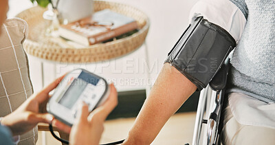 Buy stock photo Person, nurse and blood pressure machine for monitoring heart rate, BPM or medical exam in home. Hands, healthcare worker or caregiver with arm strap for health checkup, diagnosis or test in house