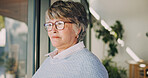 Thinking, home and senior woman by window with flashback, contemplating and vision with past memory. Retirement, serious person and reflection in house with perspective, mindset and introspection