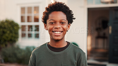Buy stock photo New home, portrait and relocation with boy outdoor in front yard for future, neighborhood or security. Property, real estate and smile of happy black child in garden for fresh start or moving in