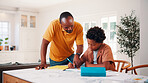 Education, helping and father in home with son for homework, teaching or writing. Learning, pointing and school assignment with family at counter in kitchen together for development or support