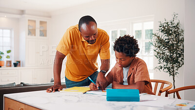 Buy stock photo Education, helping and father in home with son for homework, teaching or writing. Learning, pointing and school assignment with family at counter in kitchen together for development or support