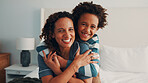 Support, smile or black family on bed with portrait, parent connection or bonding together on day off. Security, mother or child in home with hug, happy relationship or caring moment on weekend break