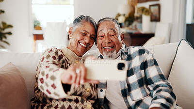 Buy stock photo Laughing, love and selfie with old couple on sofa in home living room together for bonding or memories. Funny, photograph and relax with senior people in apartment for connection or retirement