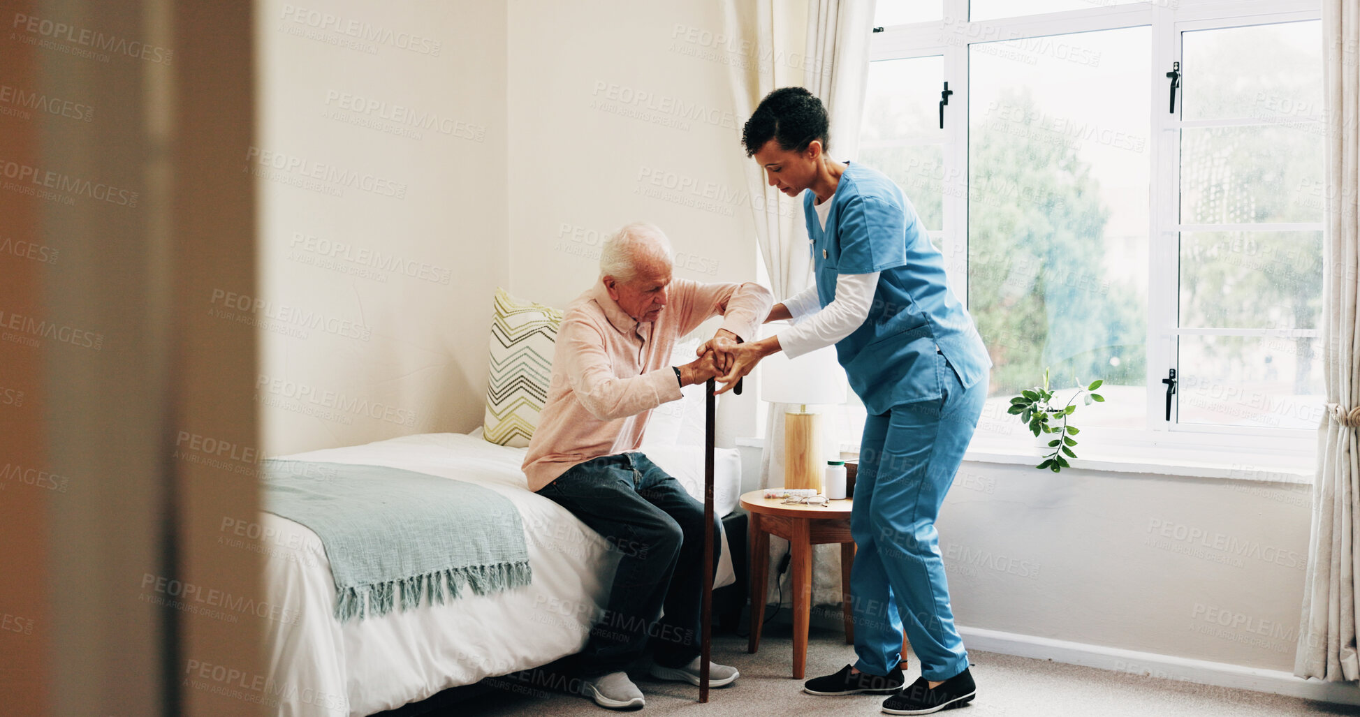 Buy stock photo Nurse, bed or helping senior with cane in home for assisted living, healthcare or service. Female person, health worker or caregiver with man in bedroom for elderly care, support or mobility in house