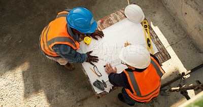 Buy stock photo Team, blueprint and engineer at construction site for discussion, development review or layout above. Top view, people and document for architecture design, building planning or strategy evaluation