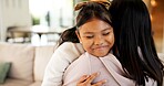 Hug, happy and child with mom in home for bonding, healthy relationship and security for parenting. Family, love and mother with girl embrace for affection, connection and support for trust in house