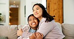 Hug, happy and child with mom on sofa for bonding, healthy relationship and security for parenting. Family, love and mother with girl embrace for affection, connection and support for trust in home