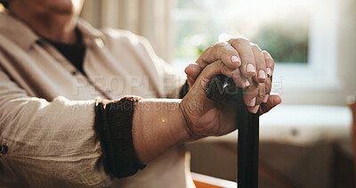 Buy stock photo Arthritis, hands and walking stick with old person in home for balance, rehabilitation or wellness. Cane, retirement and senior woman with disability in living room of apartment for break or healing