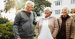 Outdoor, fitness and old people by retirement home with laugh, funny story and walk for exercise. Happy, senior friends and wellness by apartment building with garden, workout and joke for bonding.
