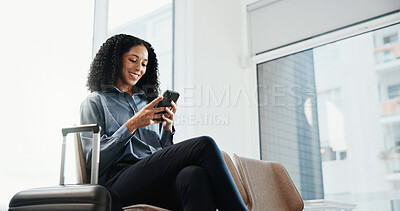 Buy stock photo Phone, travel and businesswoman in airport with suitcase for typing, texting or email on finance report. Smile, tech and financial advisor with luggage on cellphone for update on stock market on app.