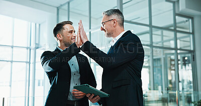 Buy stock photo Business, tablet and team in office with high five, revenue growth and good news on investor report. Happy, men and financial advisors with tech, budget approval and success in funding opportunity.