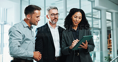 Buy stock photo Discussion, tablet and teamwork with business people in office lobby for project management. Collaboration, conversation and employee group with meeting, report and planning together in workplace