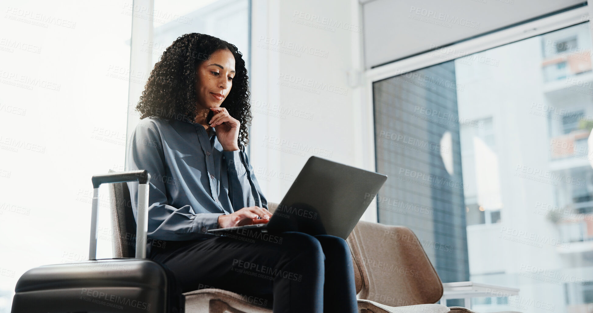 Buy stock photo Businesswoman, travel or typing in airport with laptop, thinking and planning for overseas conference. Person, computer and waiting in terminal for departure, commute and research for work trip.