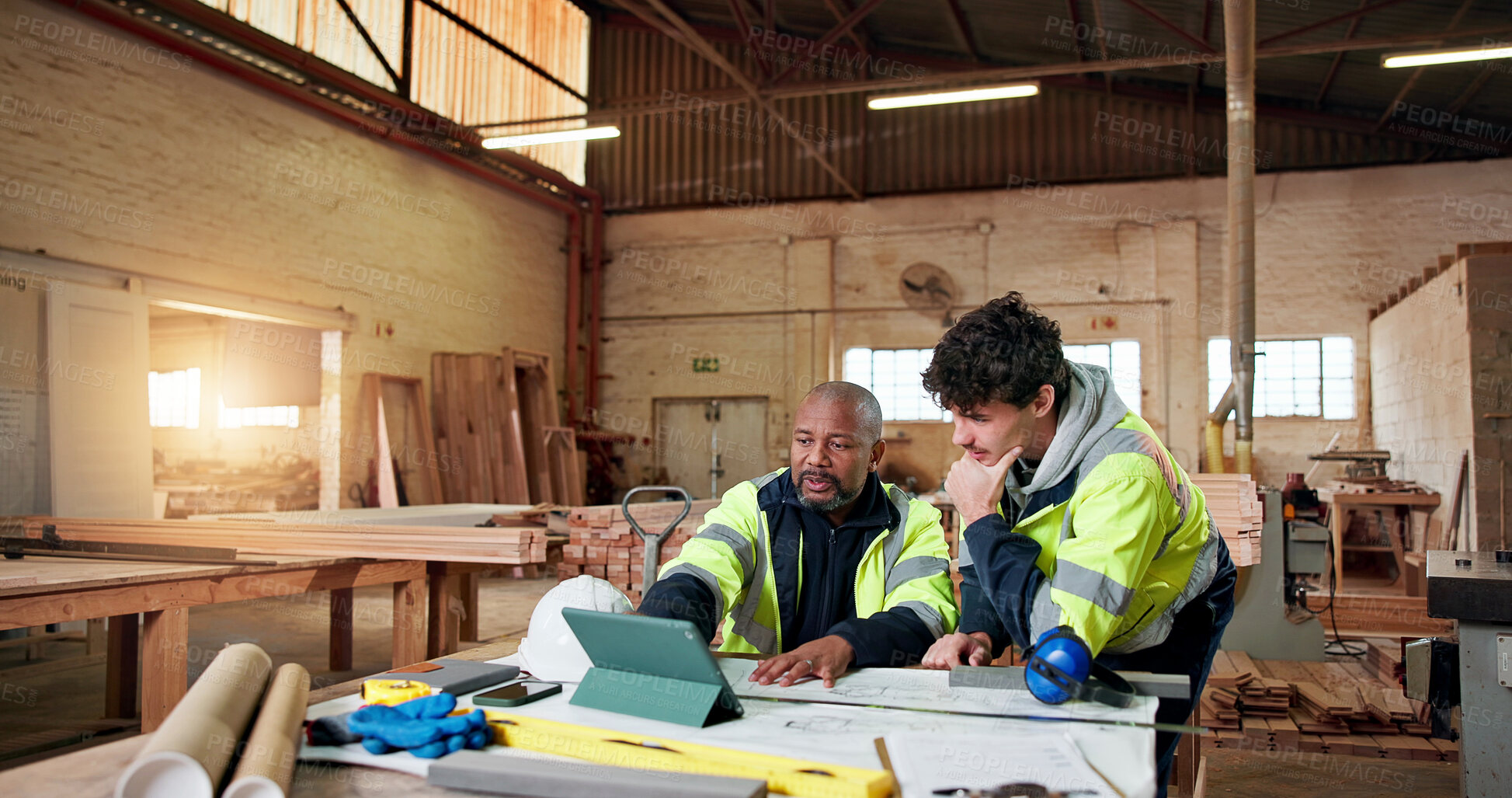Buy stock photo Carpentry, meeting and tablet with people in warehouse for engineer report, manufacturing and team. Woodworking project, collaboration and online schedule with employees in workshop for feedback