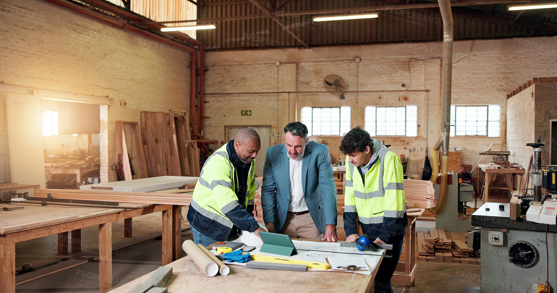Buy stock photo Carpentry, team and supervisor with people in warehouse for engineer report, manufacturing and meeting. Woodworking project, collaboration and planning with employees in workshop for feedback