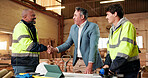 Handshake, smile and engineer with people in warehouse for  manufacturing, expansion and agreement. Construction, partner and shaking hands with employee in workshop for contractor deal and woodwork