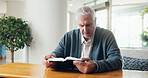 Religion, bible or old man at table with reading, theology or sacred with spiritual learning. Christian, review or elderly person with holy book, scripture study or wisdom insight in retirement home.