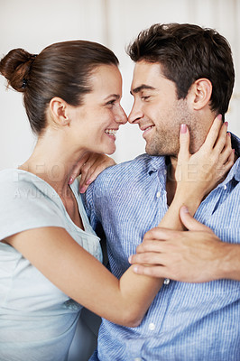 Buy stock photo Happy, couple and relax at house with love, affection and support for bonding together. Smile, people and rest in living room with embrace, admiration and marriage connection for healthy relationship