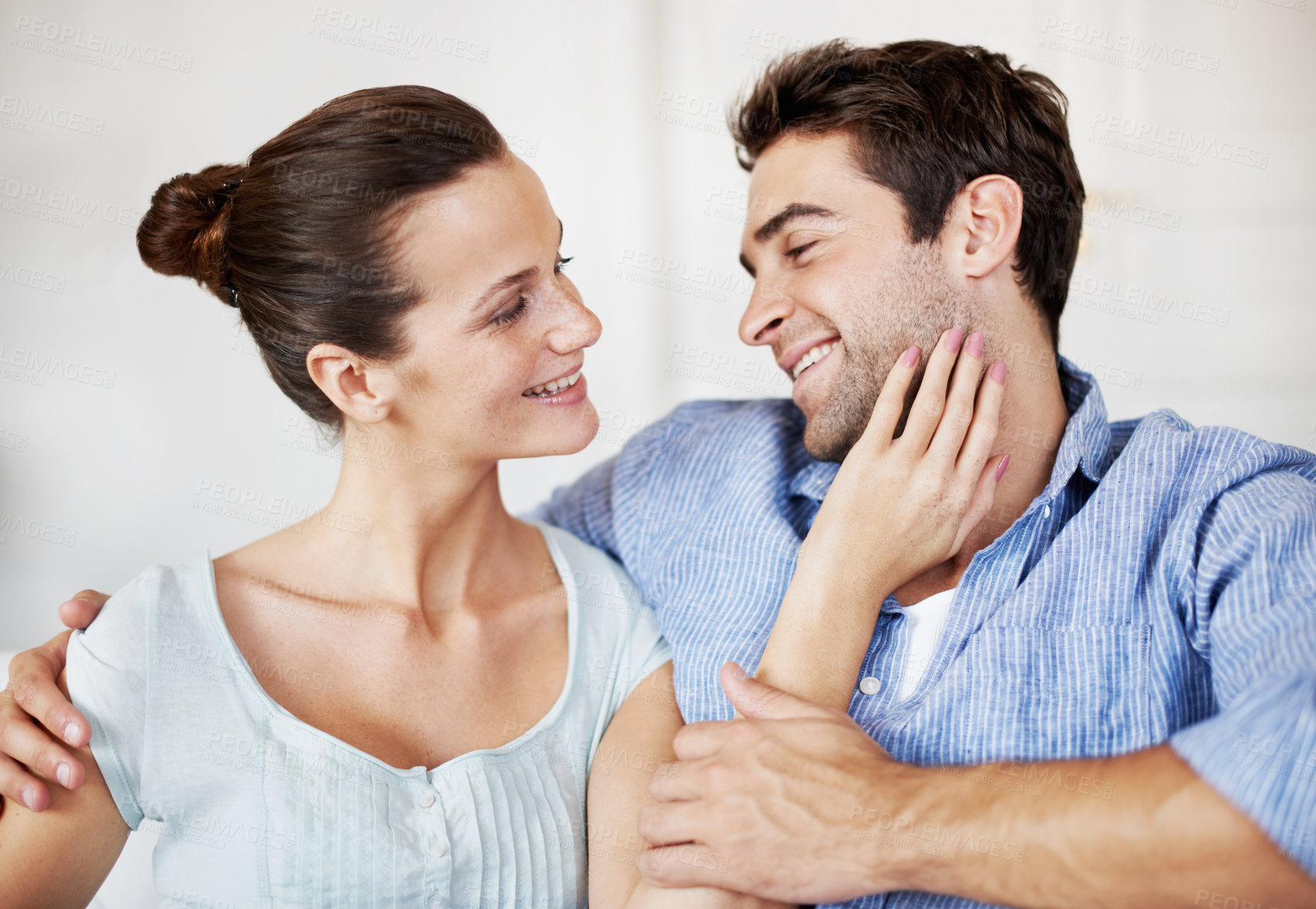 Buy stock photo Love, relax and marriage with couple on sofa in home for bonding, support and weekend break. Happy, connection and commitment with man and woman in living room of house for smile, care and loyalty
