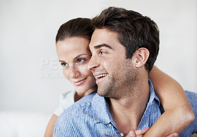 Buy stock photo Man, couple and smile with hug in home for bonding together, healthy marriage and connection. Love, trust and happy people with embrace in house for commitment, affection or adoration in relationship