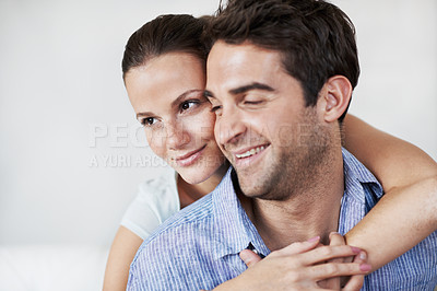 Buy stock photo Relax, couple and smile with hug in home for bonding together, healthy marriage and connection. Love, trust or happy people with embrace in living room for relationship, affection or support in house