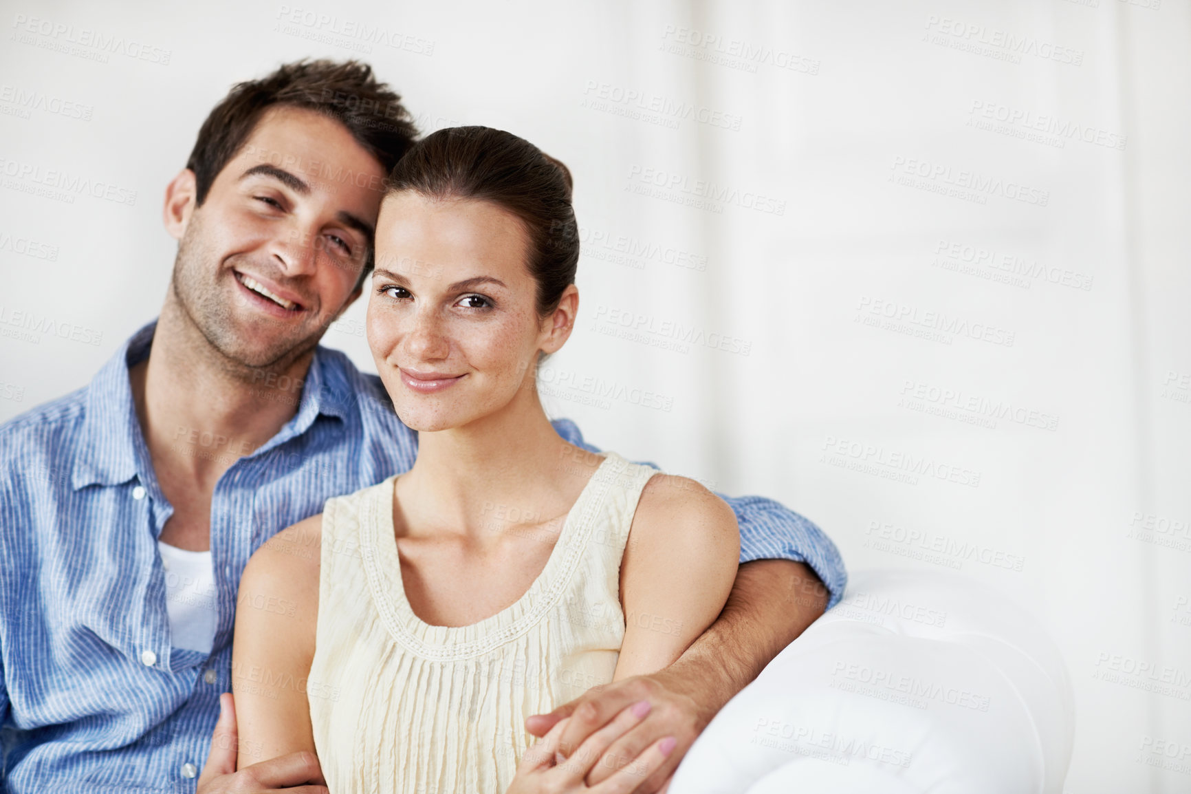 Buy stock photo Portrait, relax and smile with couple on sofa in home for bonding, support or weekend break. Happy, connection and commitment with man and woman in living room of house for marriage, space or loyalty