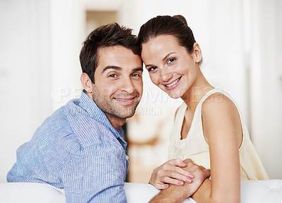 Buy stock photo Portrait, hug and care with couple on sofa for romance, bonding and support together. Calm, relax and relationship with man and woman in living room of home for marriage, happiness and smile