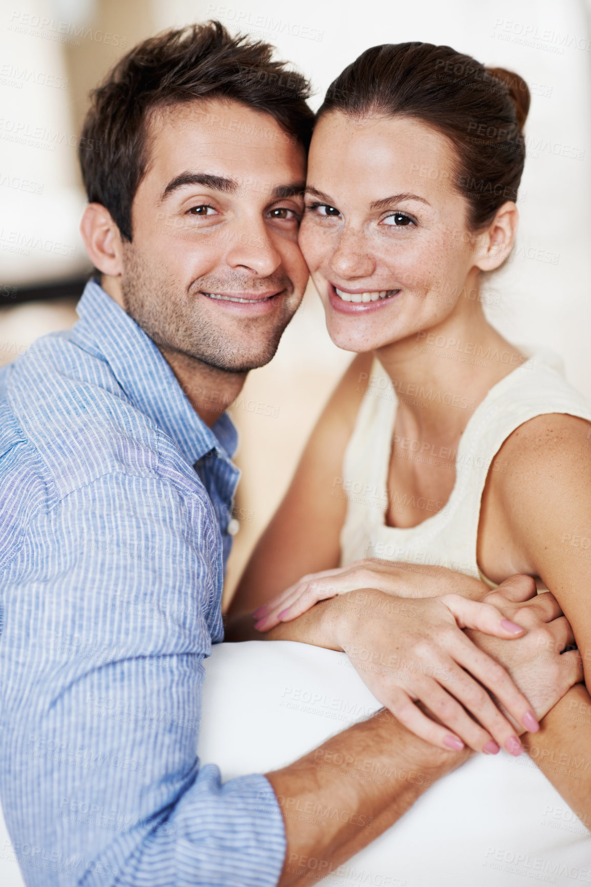Buy stock photo Portrait, holding hands and smile with couple on sofa for romance, bonding or support together. Calm, relax and relationship with man and woman in living room of home for marriage, happiness and care