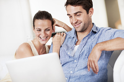 Buy stock photo Laptop, relax and love with couple on sofa for streaming service, bonding and movie subscription. Online film, smile and multimedia search with man and woman in living room of home for connection
