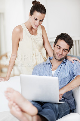 Buy stock photo Laptop, reading and research with couple on sofa for property listing, real estate purchase and planning. Happiness, future investment and mortgage review with man and woman in home for support
