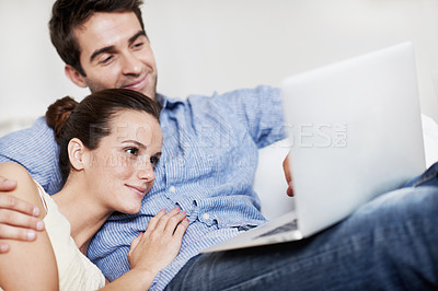 Buy stock photo Laptop, relax and smile with couple on sofa for streaming service, bonding and movie subscription. Online film, love and multimedia search with man and woman in living room of home for connection