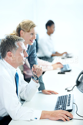 Buy stock photo Computer, team and reading with business man in office for insurance agent, research and policy review. Risk analysis advisor, help and underwriter with employees in agency for online claims