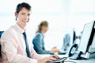 Buy stock photo Portrait, typing and computer with business man in office for smile, insurance policy and coworking. Premium claims, risk assessment agent and online review with person in agency for research