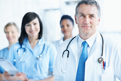 Buy stock photo Doctor, portrait and mature man in hospital for healthcare mission, solidarity and consulting. Medical, community and about us with people in lobby of clinic for support, nurses and collaboration