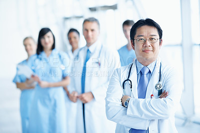 Buy stock photo Doctor, portrait and arms crossed with man in hospital for healthcare mission, solidarity and consulting. Medical, community and about us with people in clinic for support, nurses and collaboration