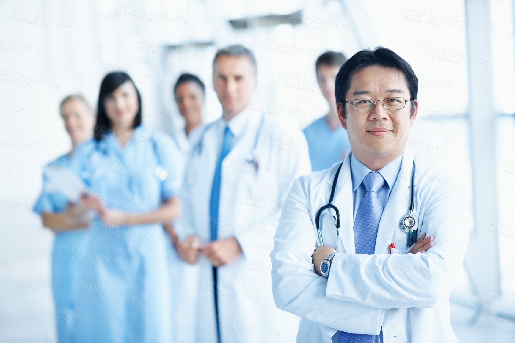 Buy stock photo Doctor, portrait and arms crossed with man in hospital for healthcare mission, solidarity and consulting. Medical, community and about us with people in clinic for support, nurses and collaboration